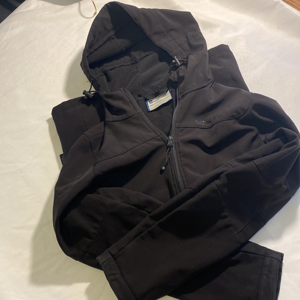 Woman’s waterproof hooded coat size 6.